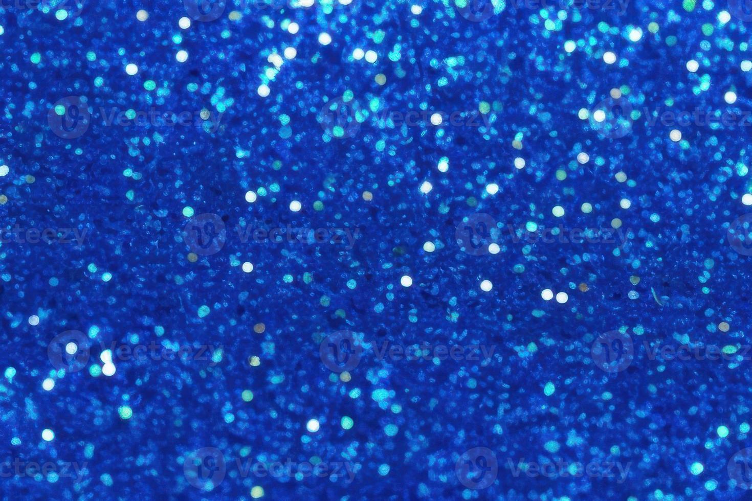 blue background with gradient, bokeh and sparkles on blue background photo