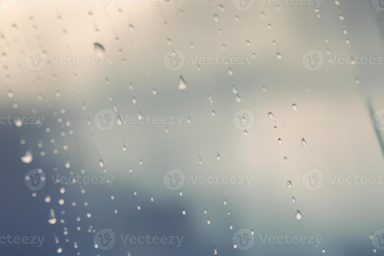 small water drop on the glass window, minimalistic design backdrop with copy space photo