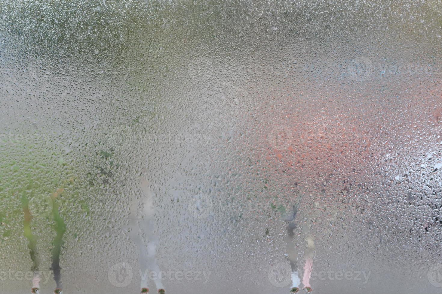 Glass with water vapor, fog, flow. a window with water drops. fogged