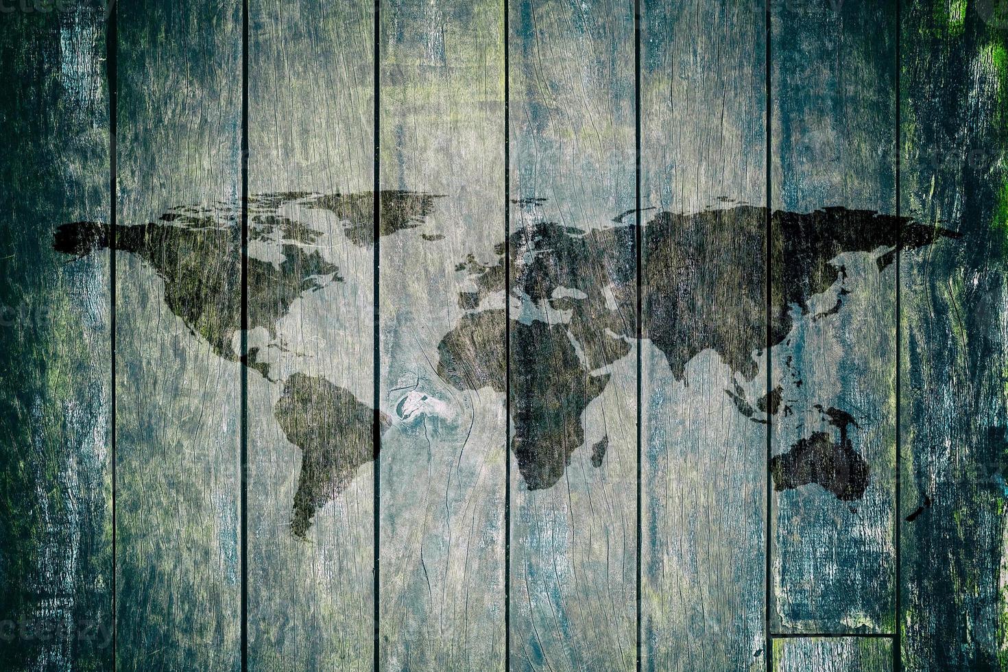 World Map on Old Wooden Wall Texture Background. photo