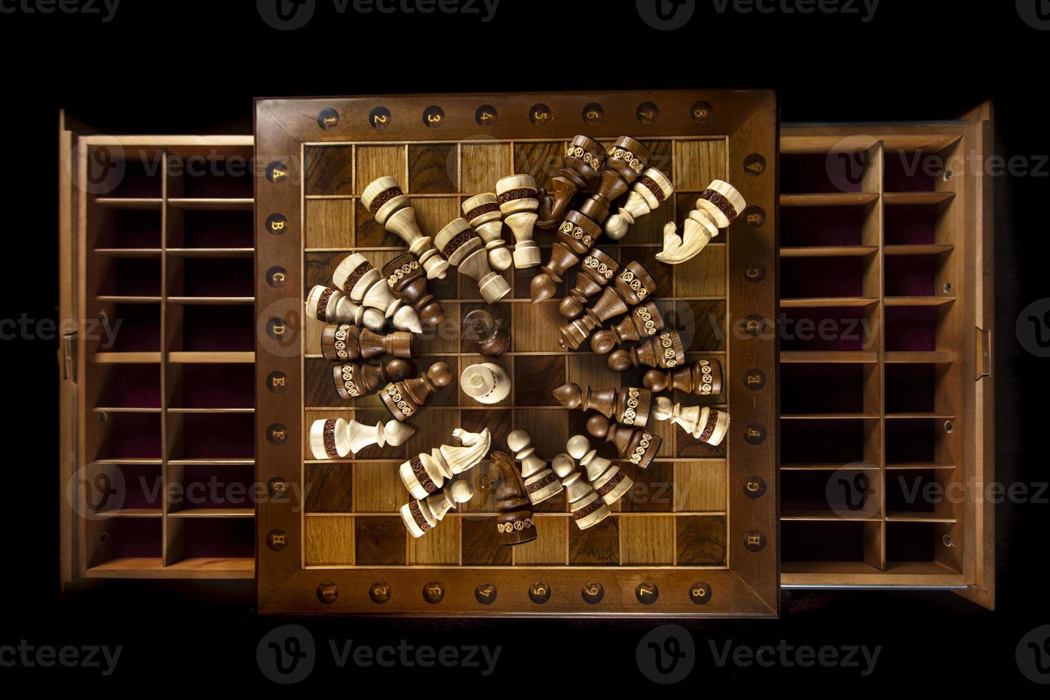Chess pieces are laid out on a chessboard. A puzzle game with tricky combinations that requires planning and thinking. photo