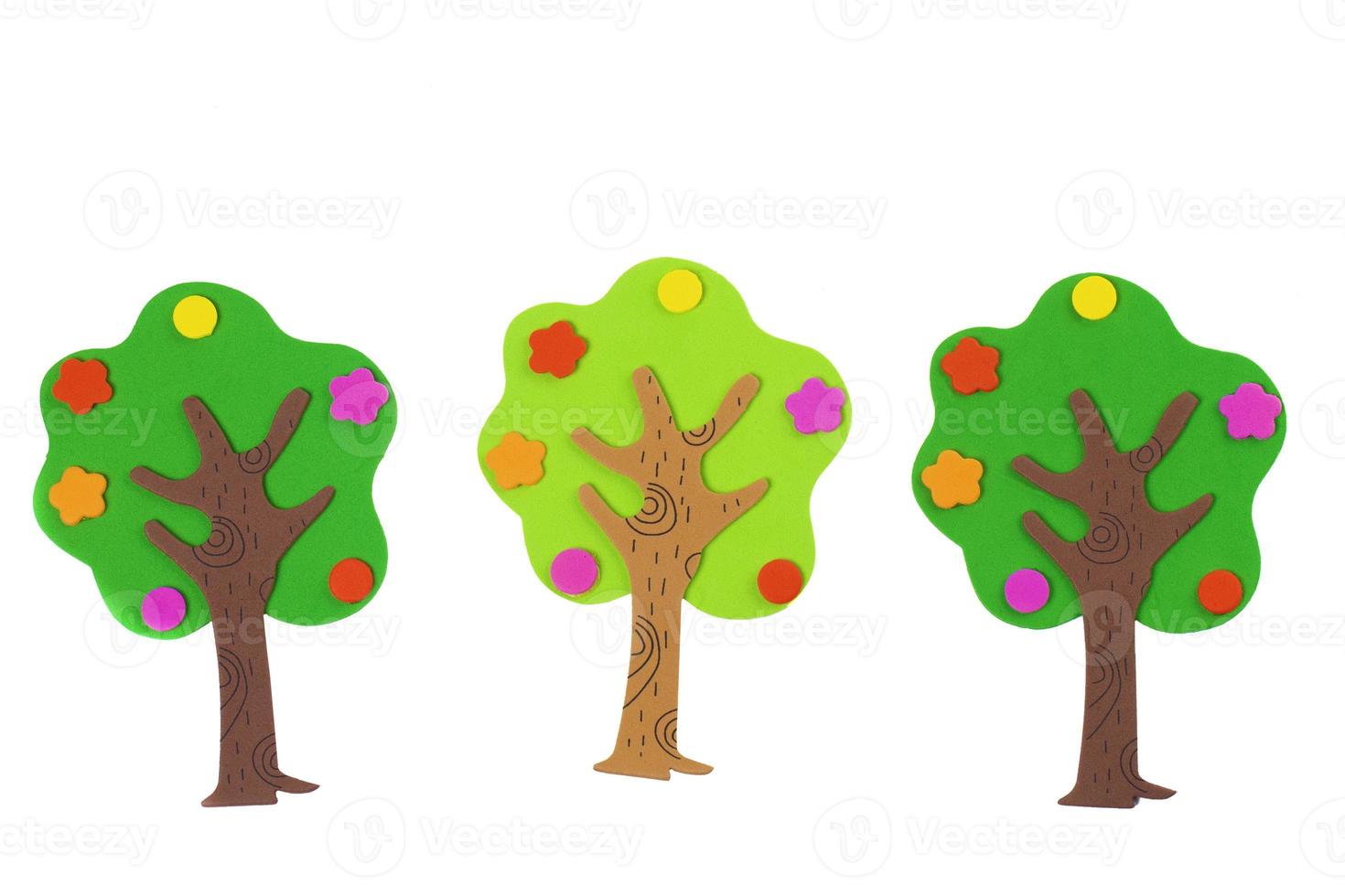 Handcrafted fabulous toy trees made from soft material. Tree on a white background. Garden and fertility concept. photo