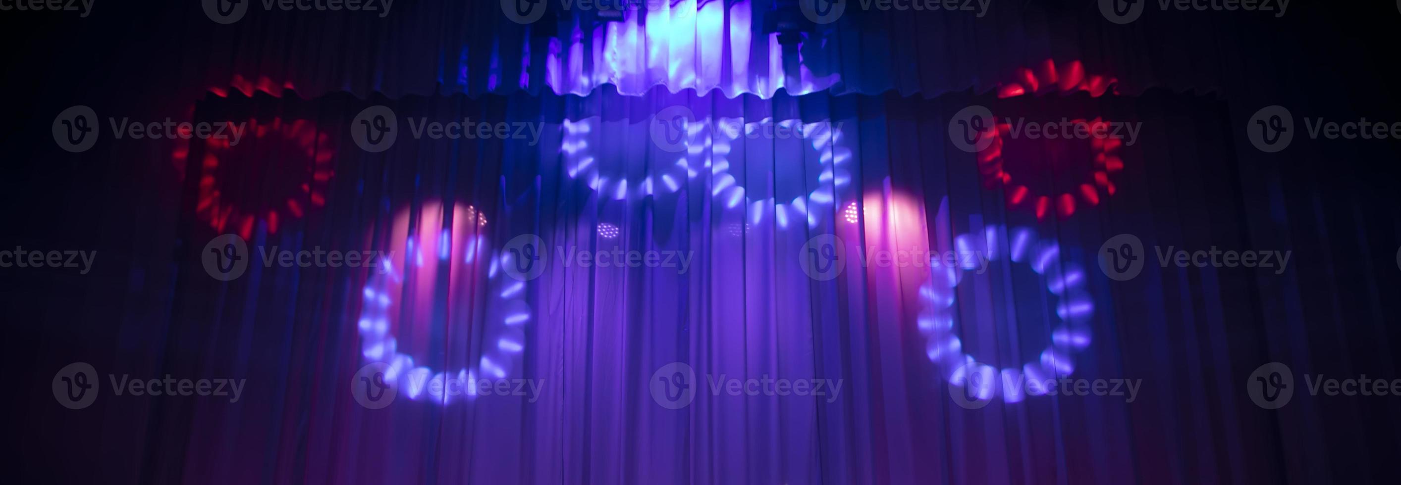 Baner theatrical curtain in the rays of the stage spotlight. photo