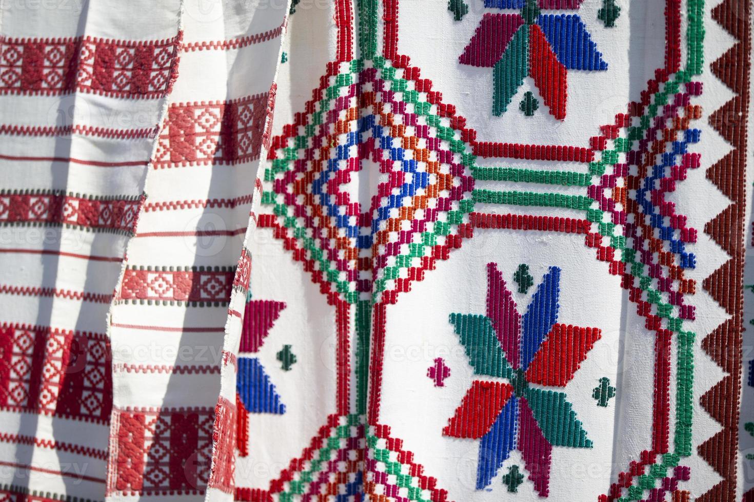 Slavic embroidered towels. National Ukrainian or Belarusian ethnic patterns on the fabric. photo