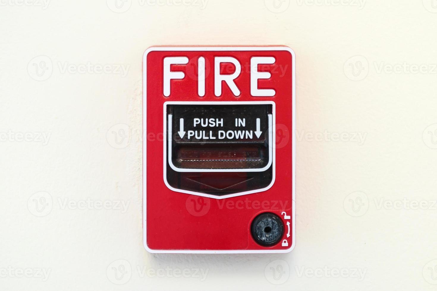 Fire alarm switch on white wall background photo