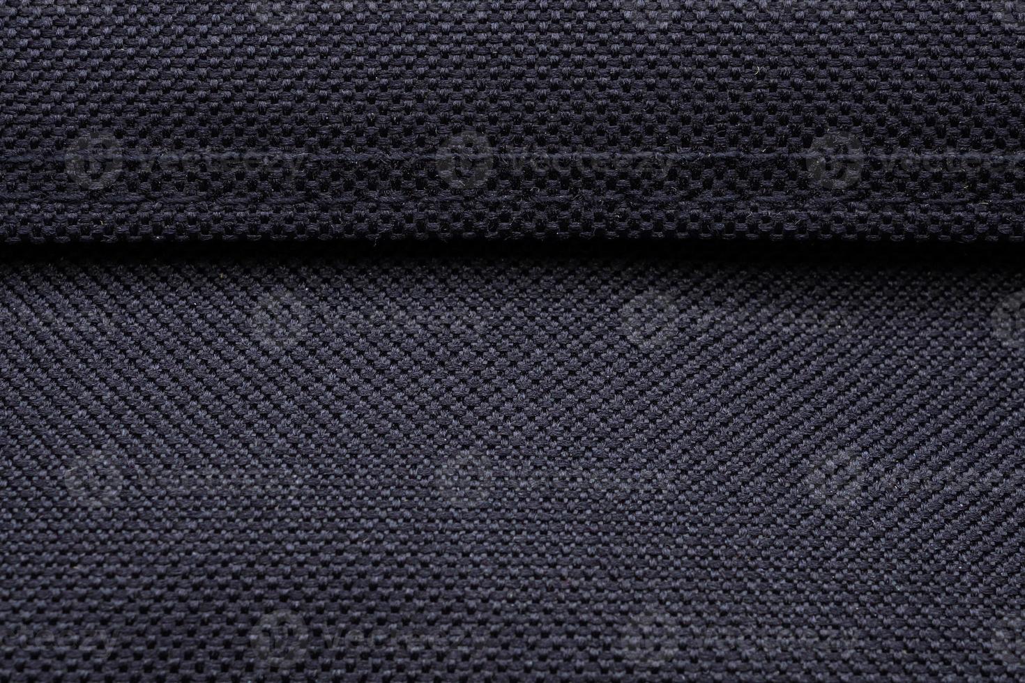 Black fabric texture pattern with stitch background photo