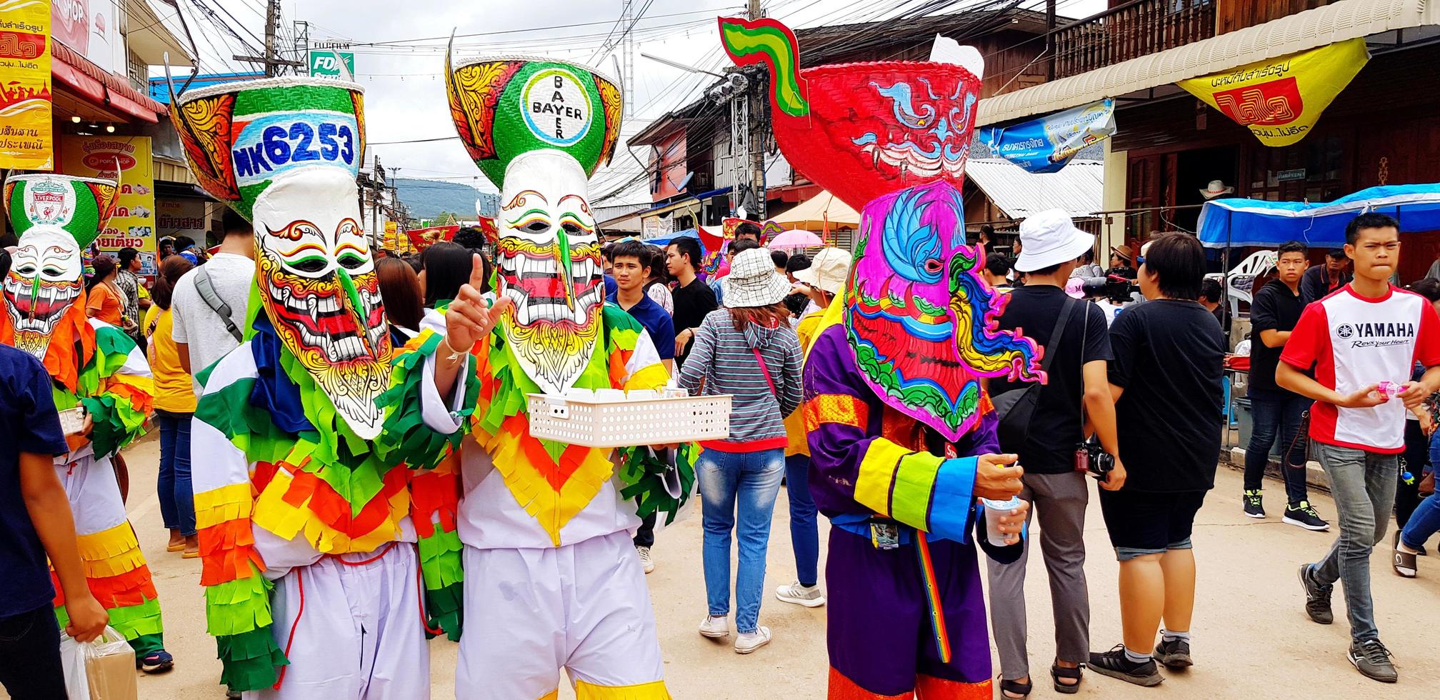 Loei, Thailand-July 26, 2022 Phi Ta Khon or Ghost festival in Thailand. The local people made to wearing colorful cloth and ghost mask for celebrated culture or traditional on July of every year. photo