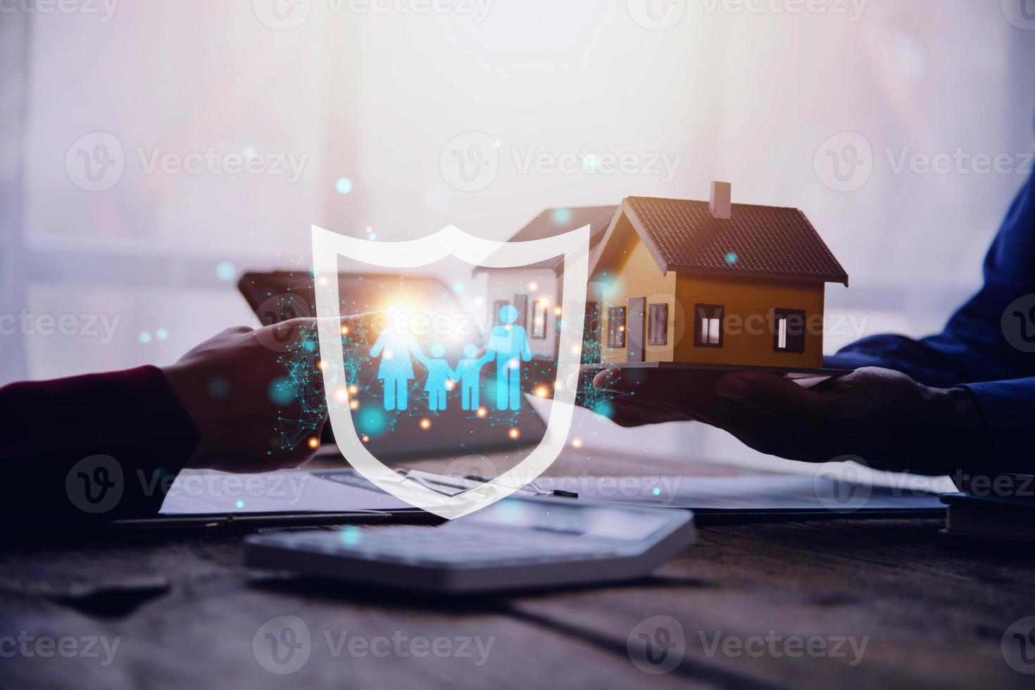 Businessman with protective gesture and family, life, health and house insurance icons. Insurance concept, Family life insurance and policy concepts. photo