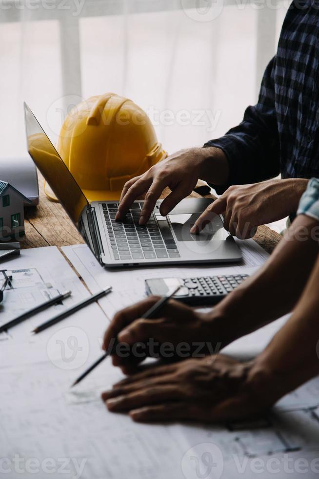 Construction and structure concept of engineer working drawing on blueprint meeting for project working with partner on model building and engineering tools in working site, construction concept photo