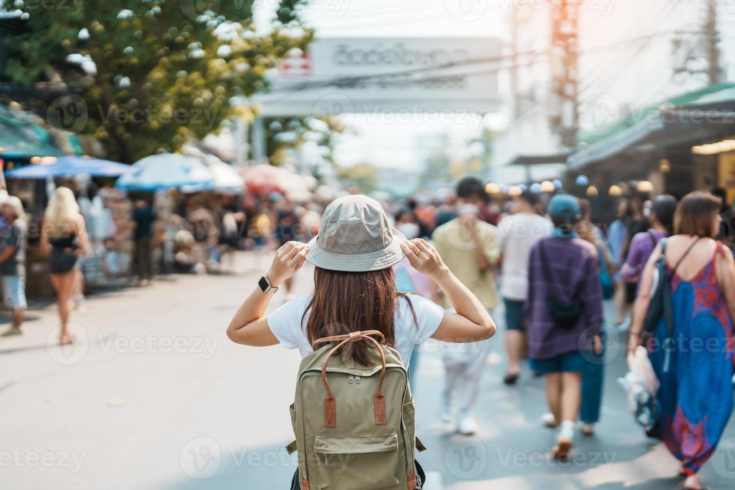 woman traveler visiting in Bangkok, Tourist with backpack and hat  sightseeing in Chatuchak Weekend Market, landmark and popular attractions  in Bangkok, Thailand. Travel in Southeast Asia concept 21601287 Stock Photo  at Vecteezy