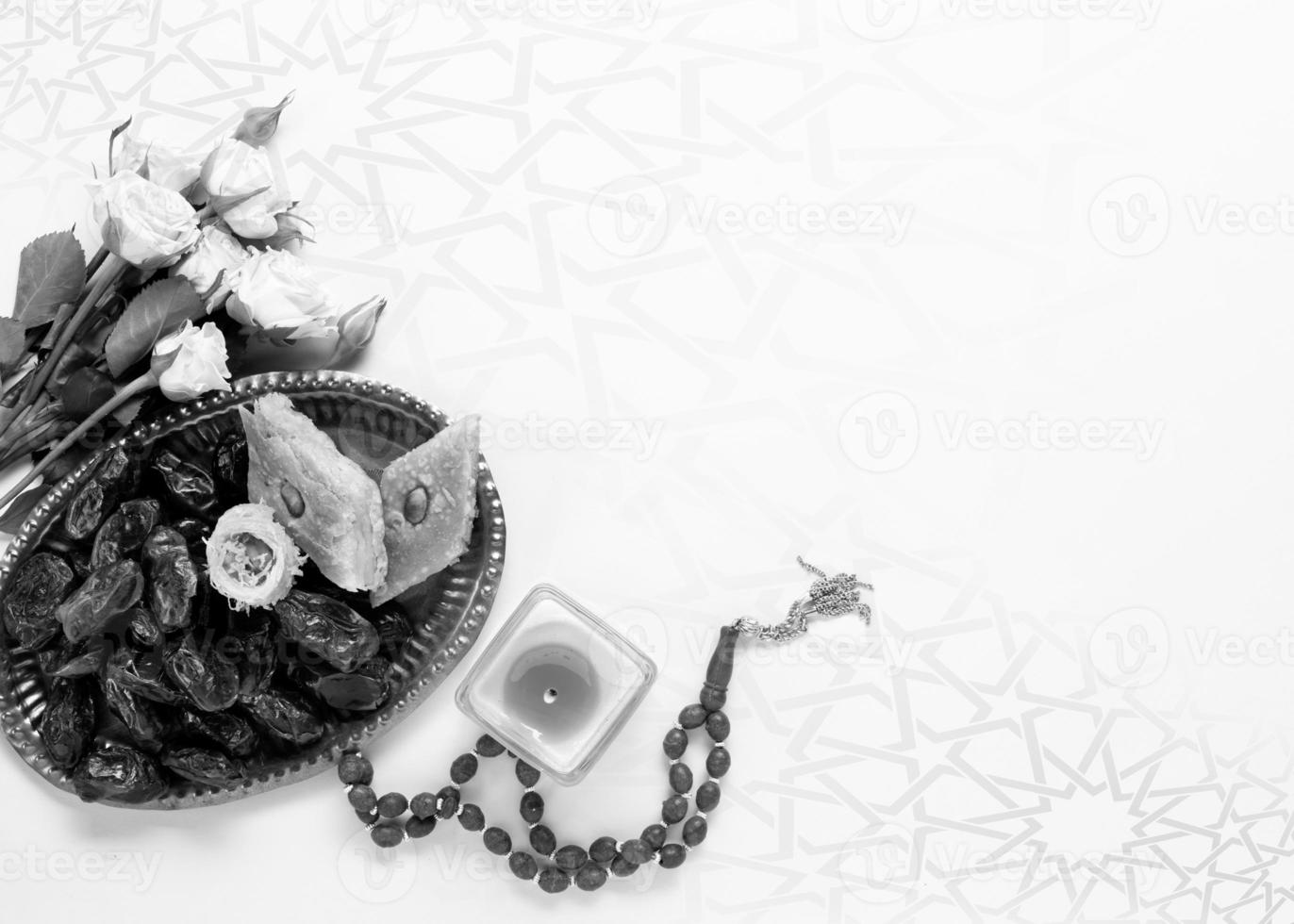 A basket of fruit and a candle with a small silver box on the table with copy space islamic ramadan . Ramadan Kareem. Islamic greeting template with ramadan for wallpaper design photo