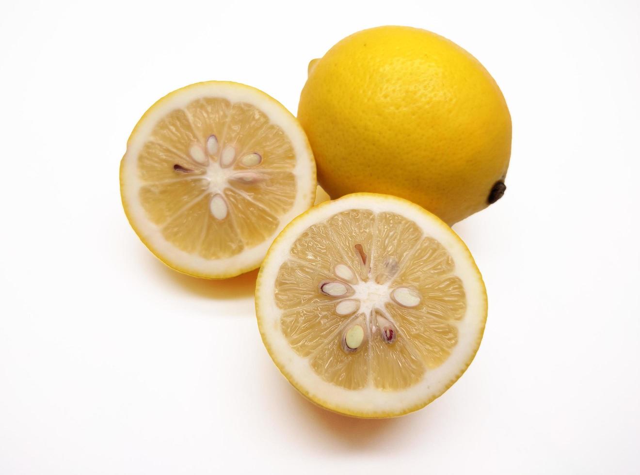 A slice of yellow lemon isolated in white background photo