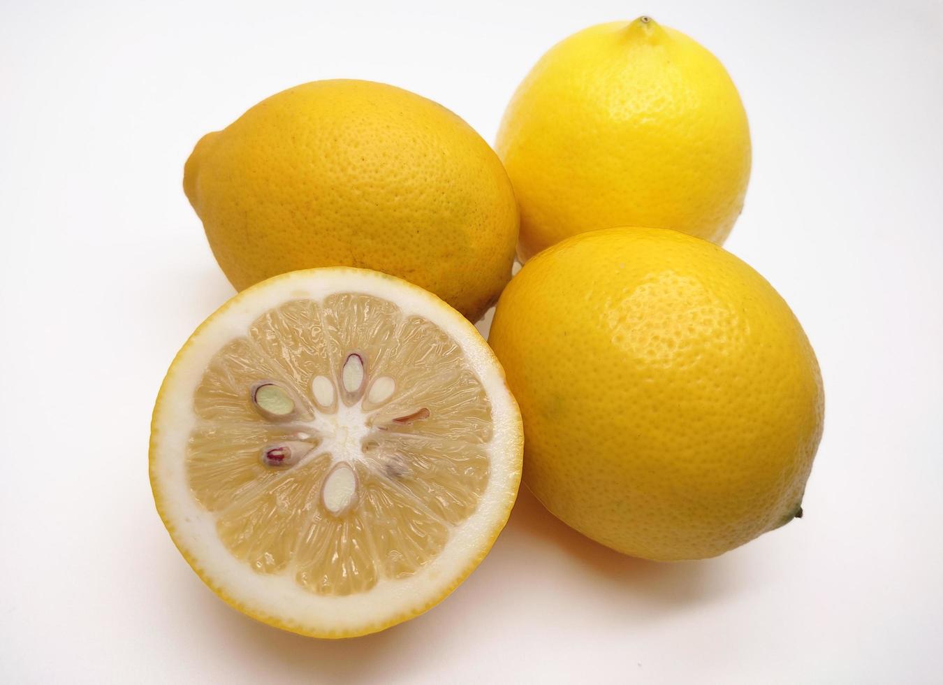 A slice of yellow lemon isolated in white background photo