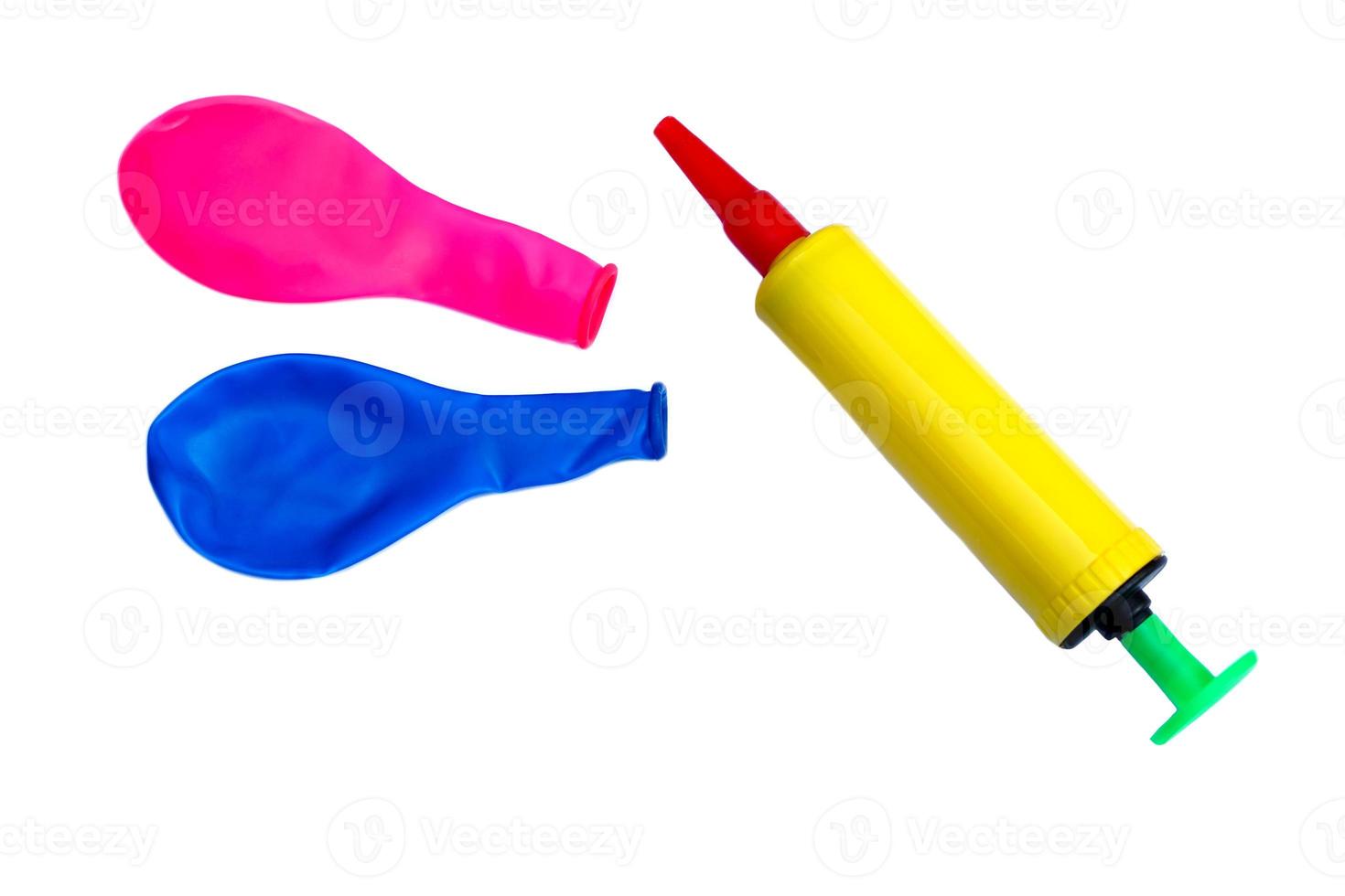 Colorful balloons  and air pump, inflates  air to balloon, isolated on white background. Concept, toy and equipment to play fun games or prepare party. photo