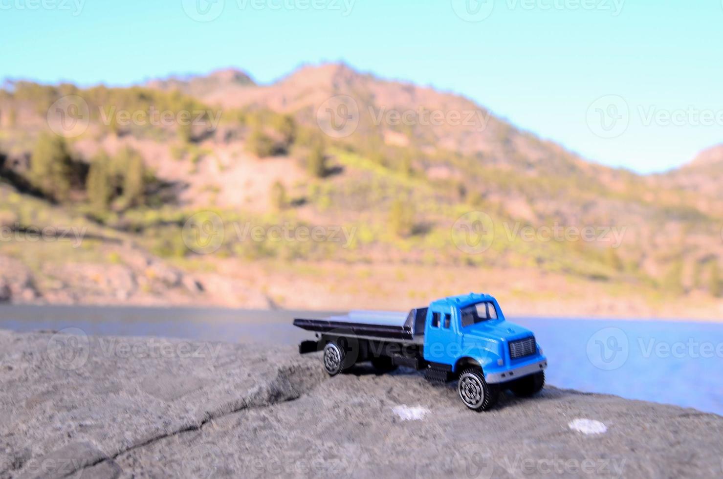 Toy truck on a rock photo