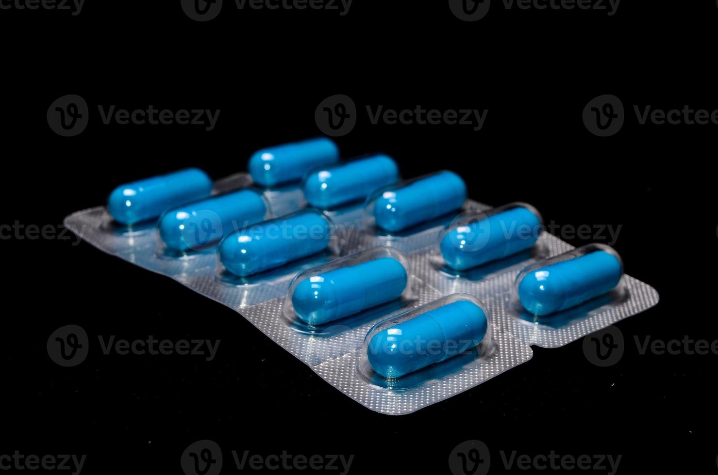 Blue pills in blister package photo