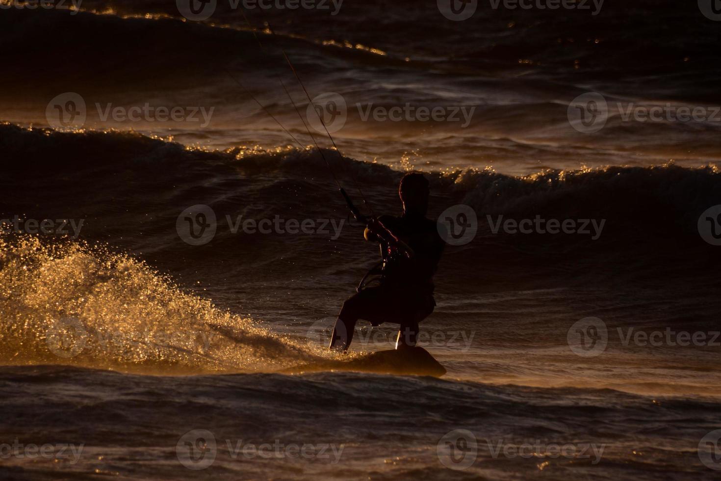 Kitesurfer at sunset photo