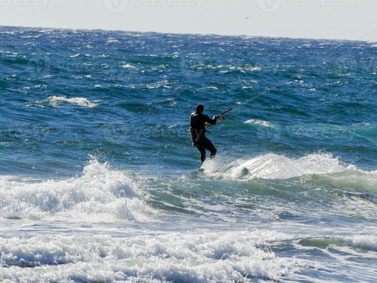 Kitesurfer at sunset photo