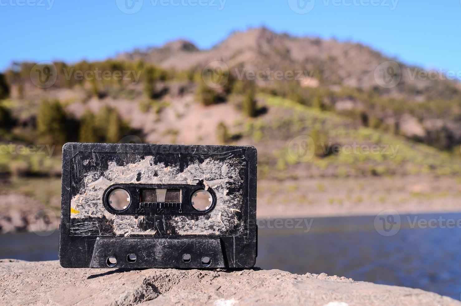 Cassette tape on a rock photo