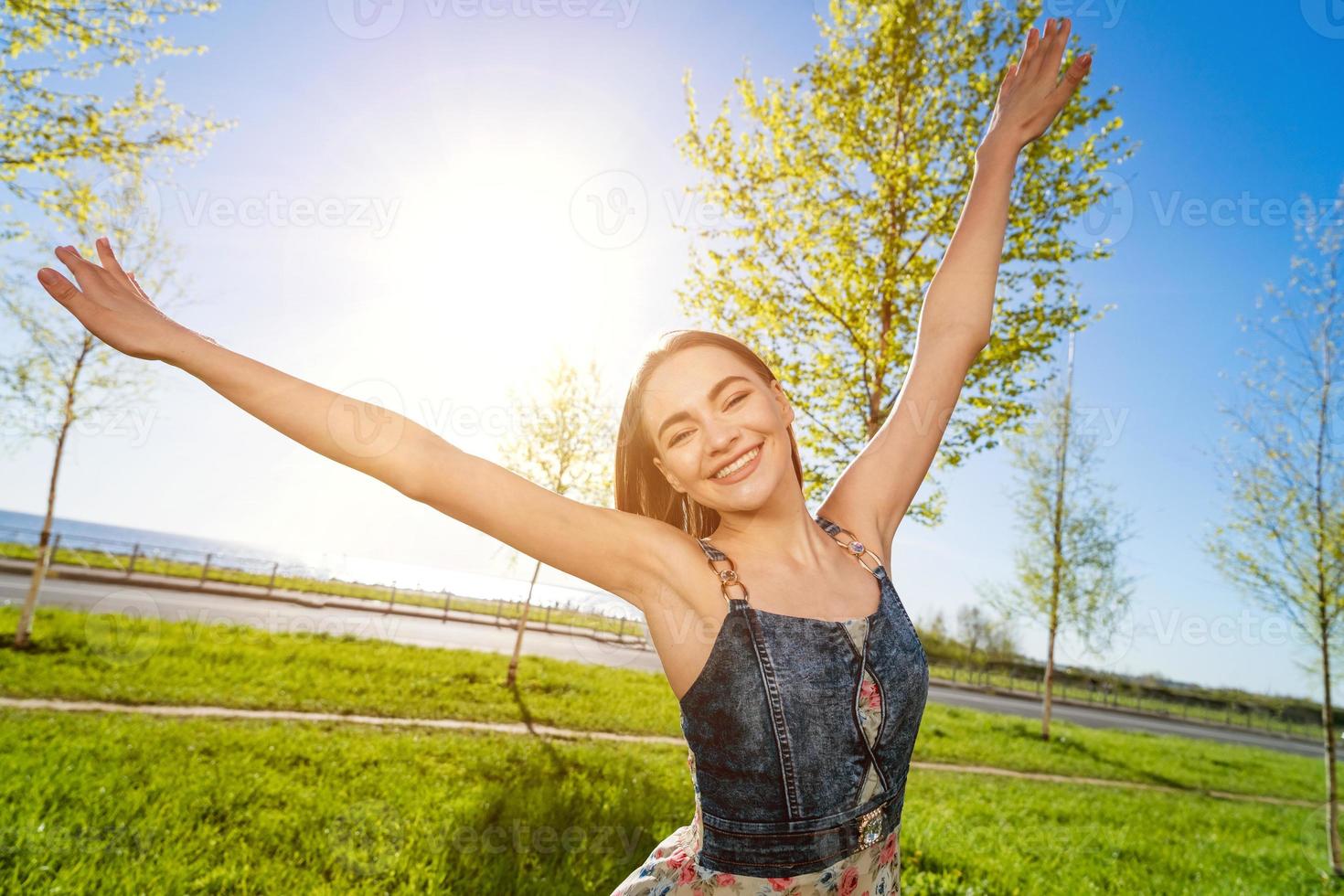 Happy free young girl in long dress. Beauty romantic girl outdoors. Woman photo