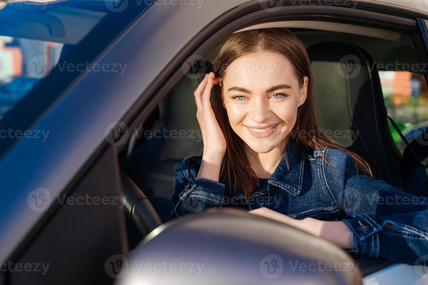 Nice young lady happy car. Image beautiful young woman who drives car photo