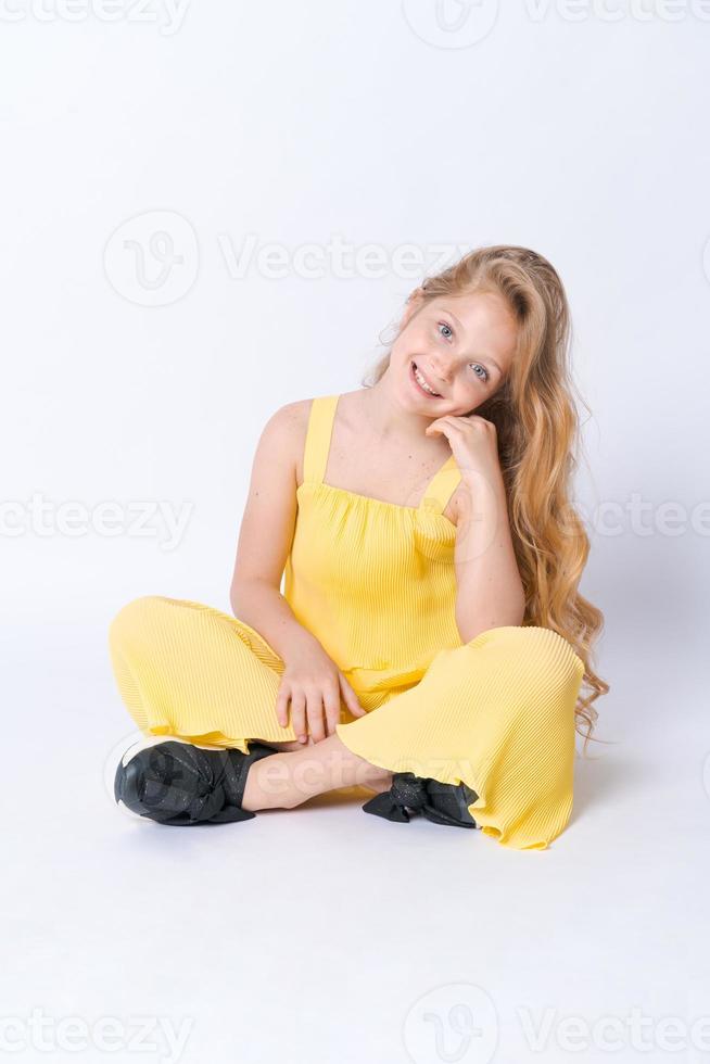 Fashion Studio Teen Style Style in shoes. Fashionable young girl wears summer photo