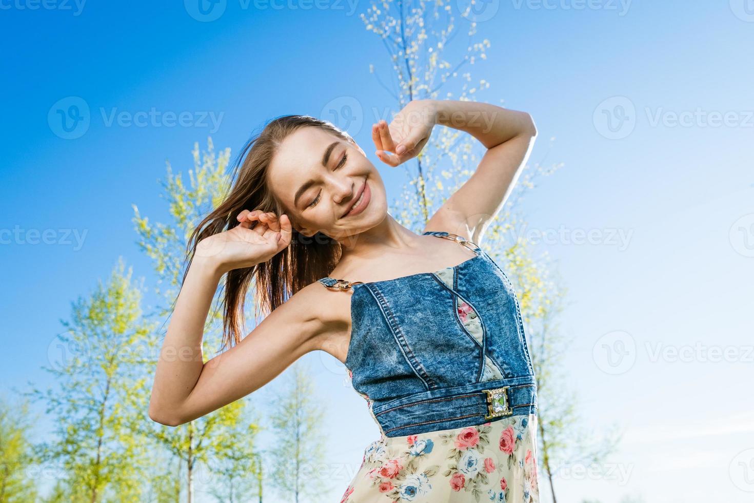 Happy free young girl in long dress. Beauty romantic girl outdoors. Woman photo