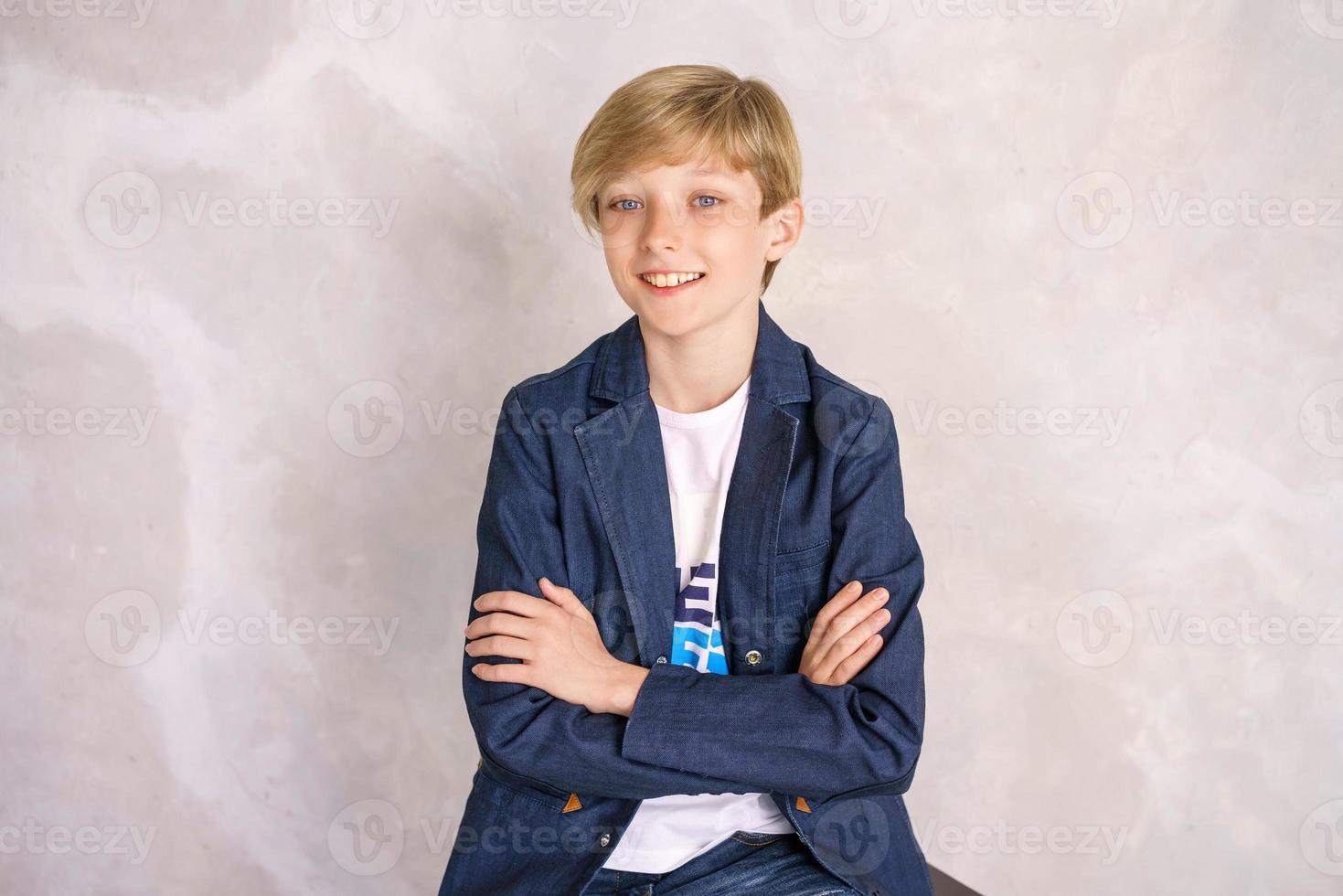 guy posing in the studio on a light wall background photo