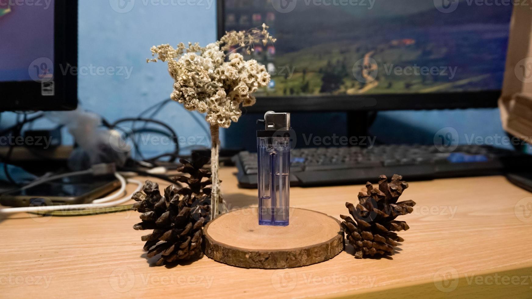 Cigarette lighter standing on wooden photo