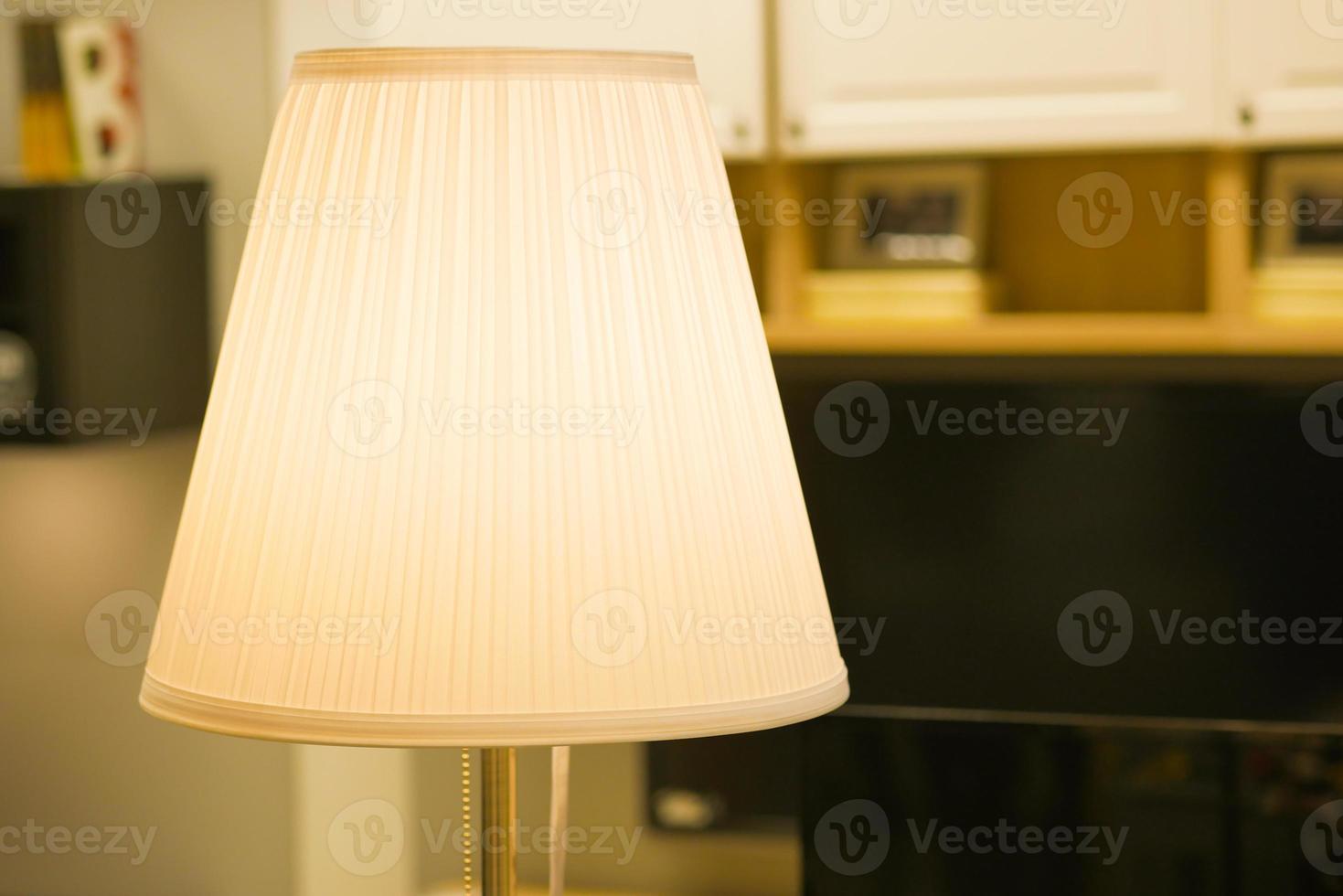 a lamp in home against white wall photo