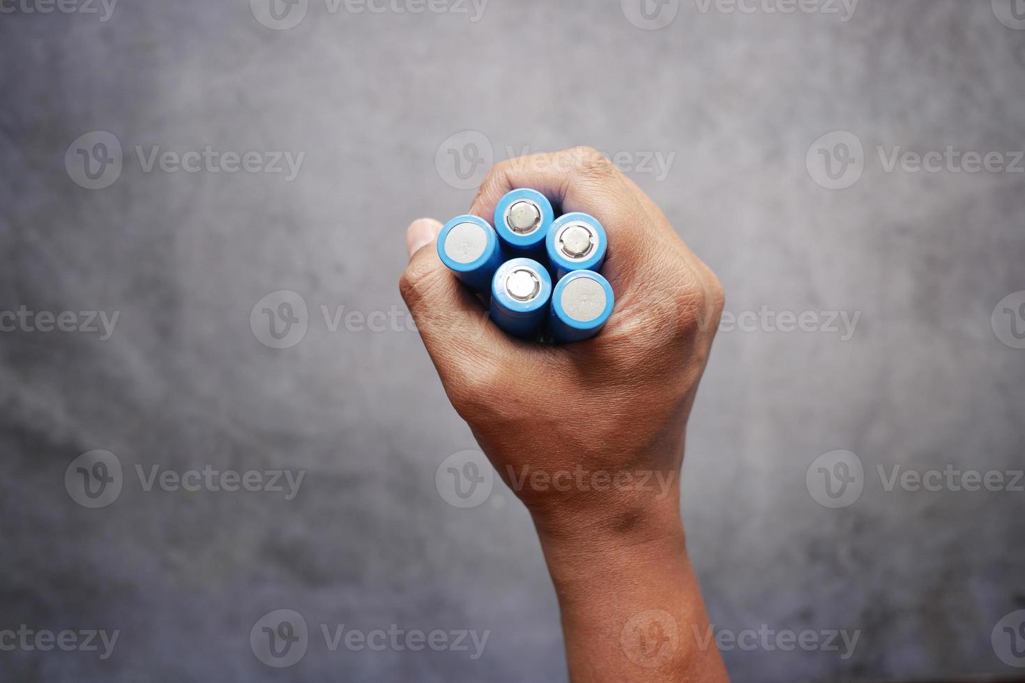 close up of holding Batteries photo