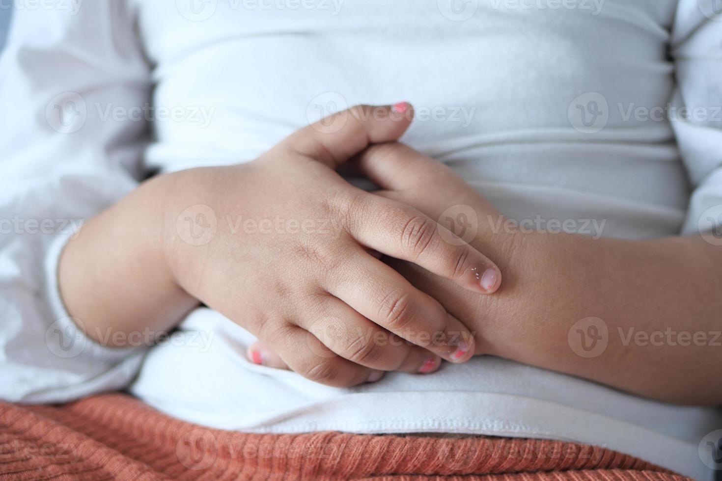 child suffering stomach pain close up. photo