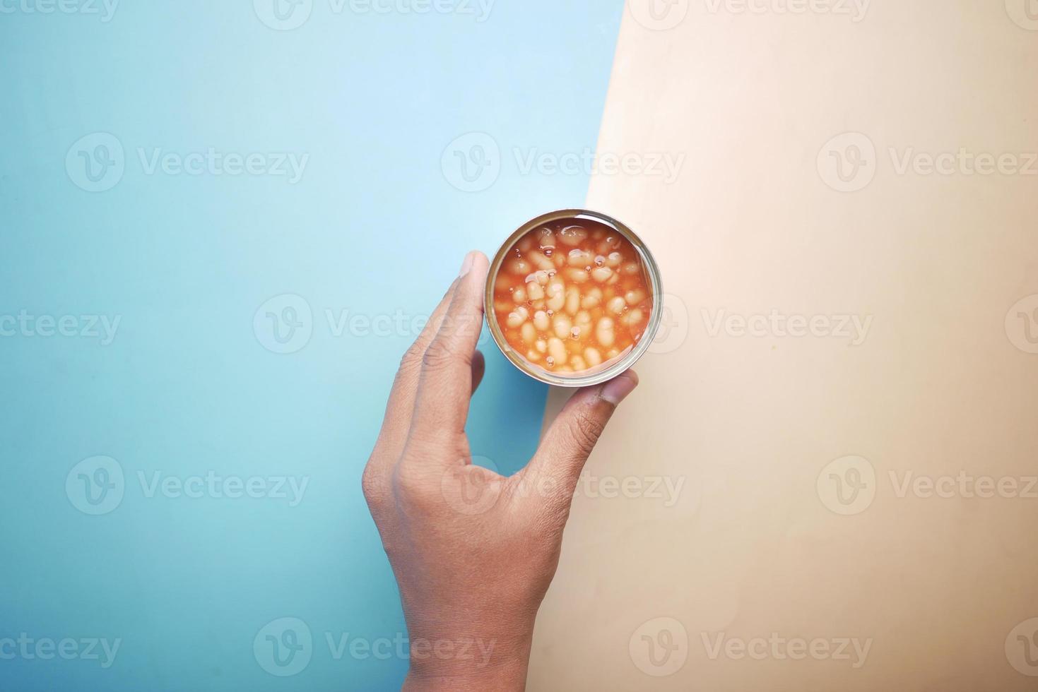 preserved canned tomato beans in a container photo