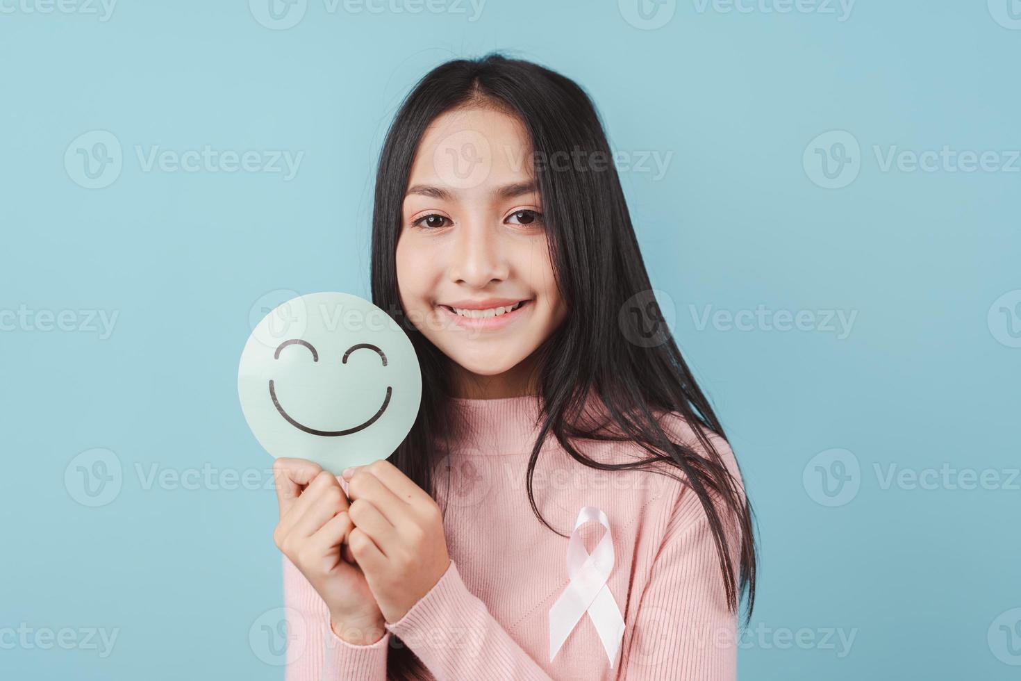 woman holding happy smile face on paper cut, user giving good feedback rating, think positive , customer review, assessment, of mental health day, Compliment Day, satisfaction concept. photo