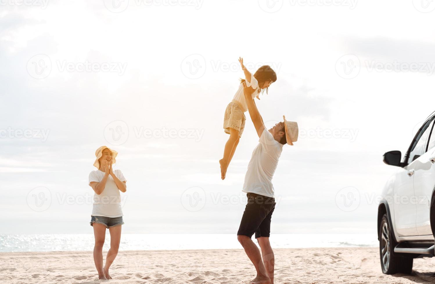 Happy Family with car travel road trip. summer vacation in car in the sunset, Dad, mom and daughter happy traveling enjoy together driving in holidays, people lifestyle ride by automobile. photo