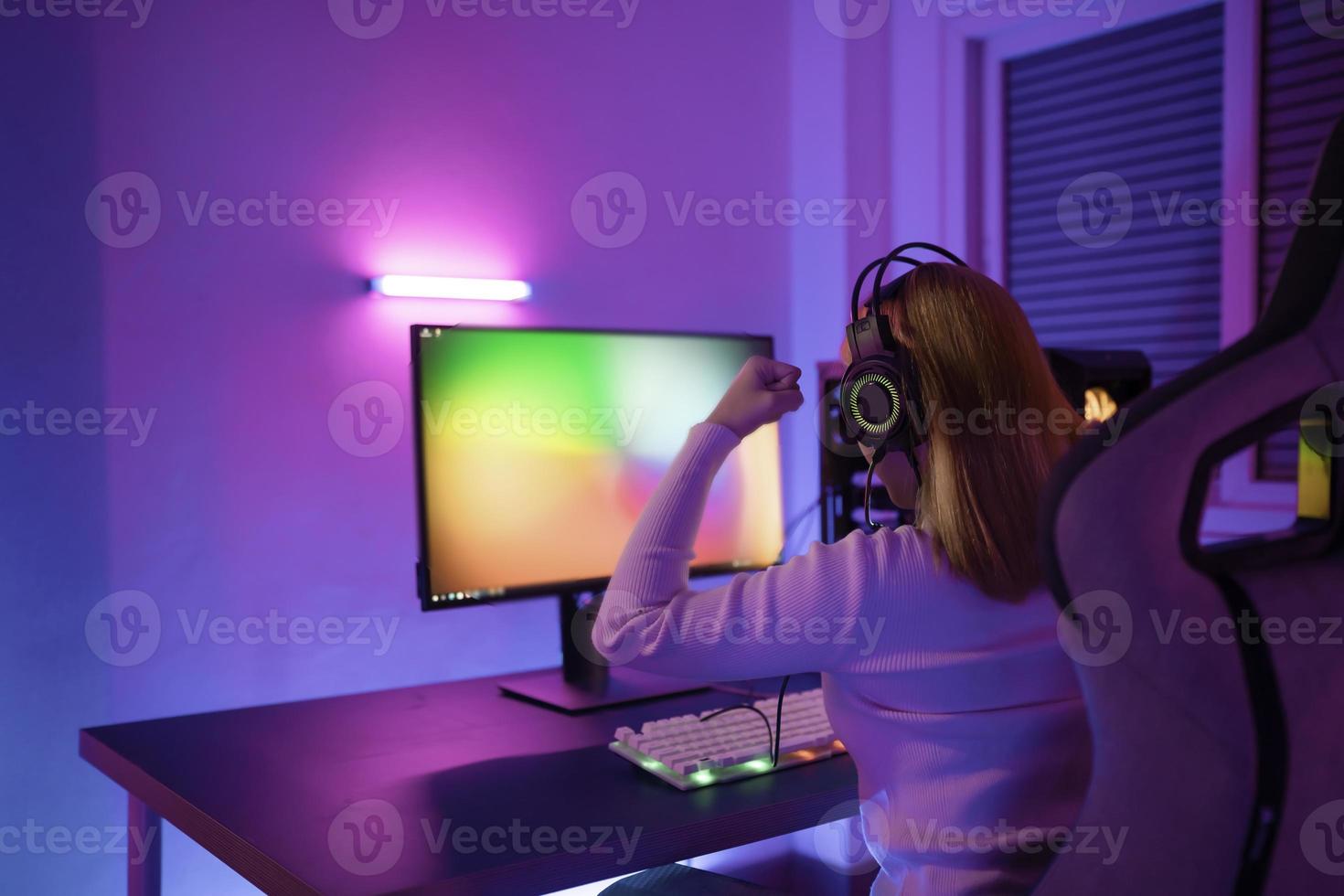 Asian woman gamer play computer video game concept. photo