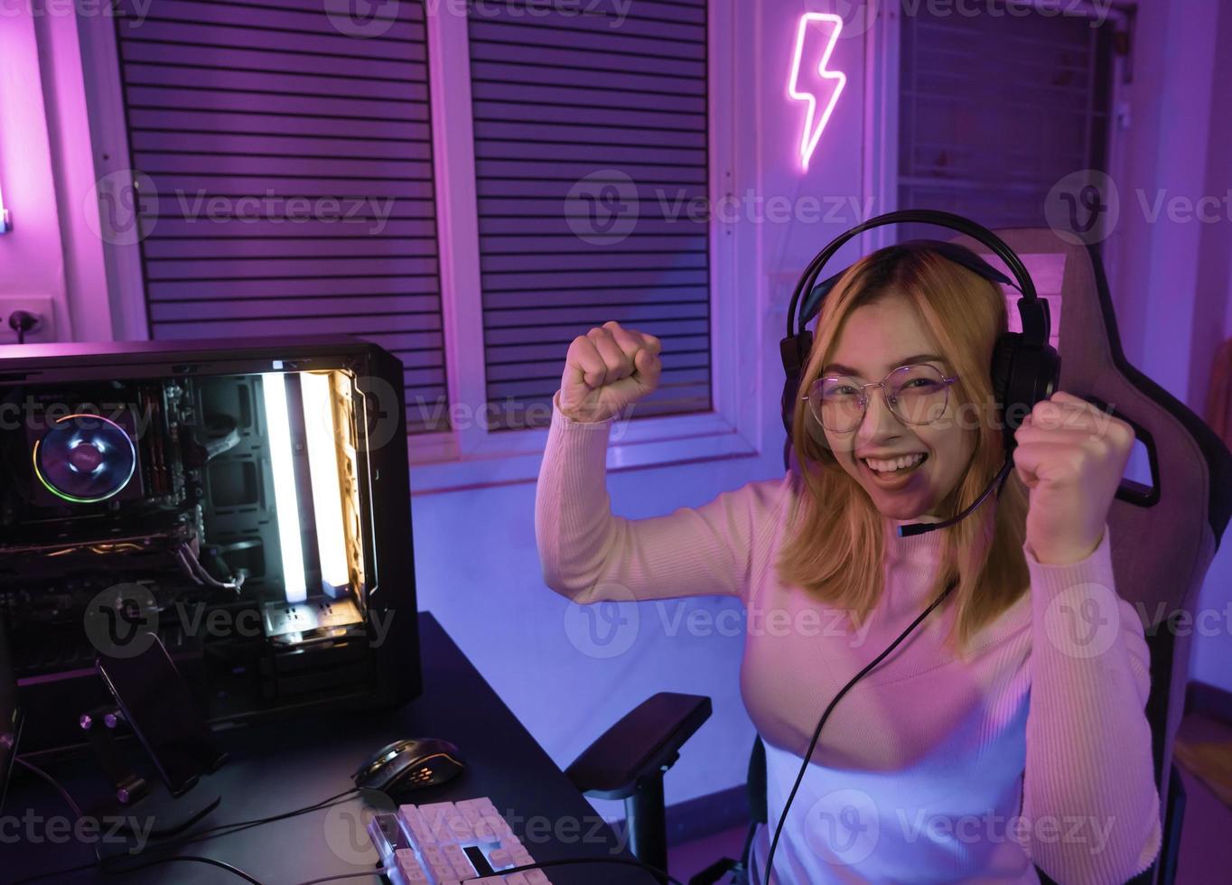 Asian woman gamer play computer video game concept. photo
