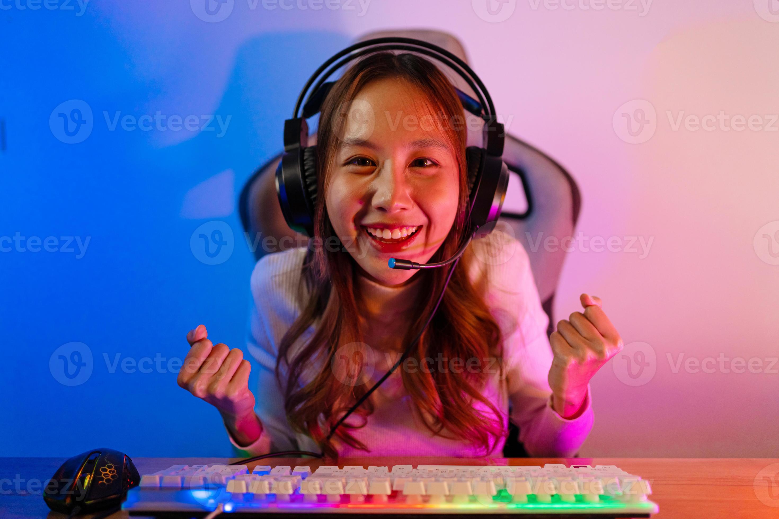 Footage of Young Asian esport woman gamers playing online video games on  the computer with neon light at home. Attractive girl gaming player feels  enjoy technology broadcast live streaming. 25213471 Stock Video