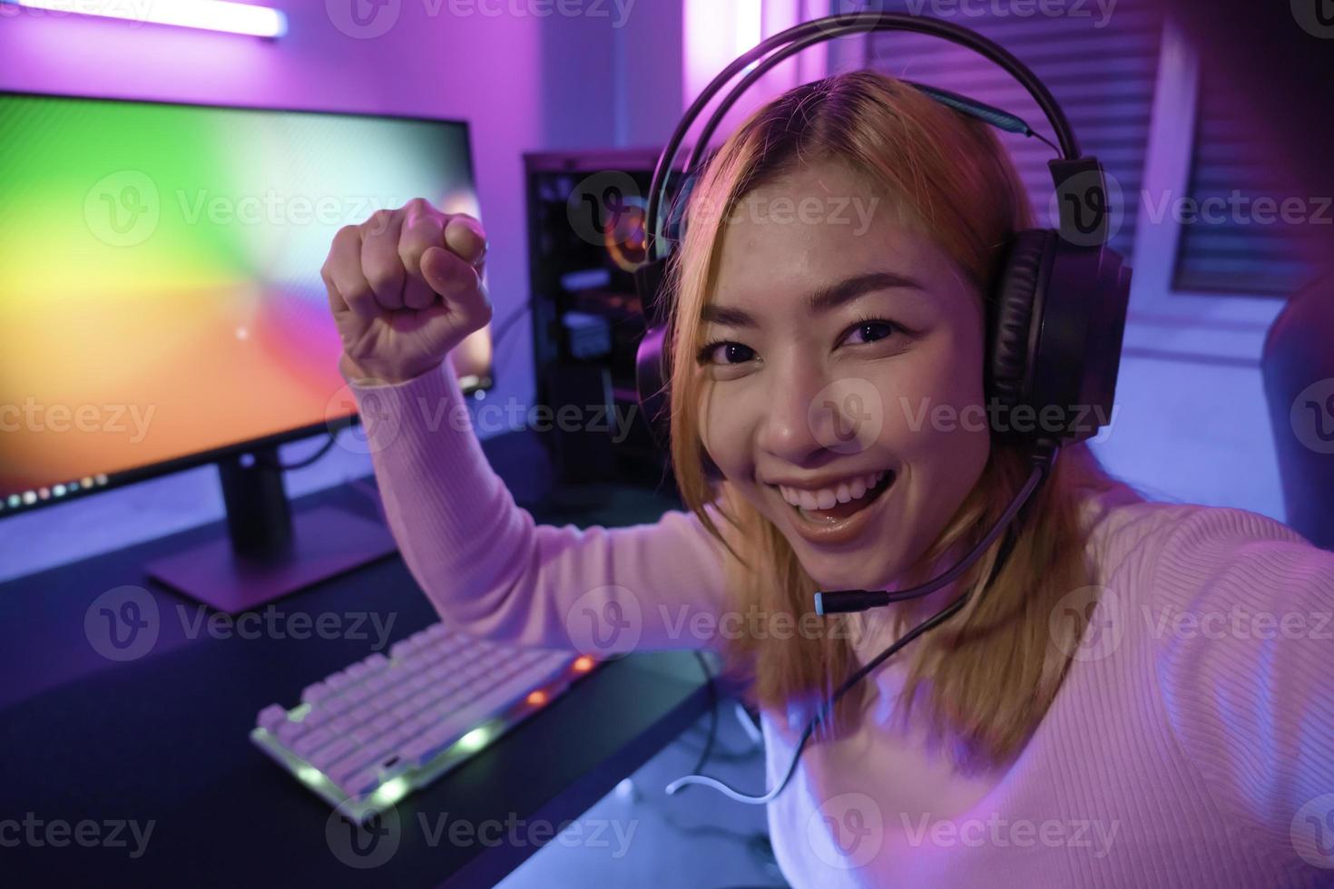 Asian woman gamer play computer video game concept. photo