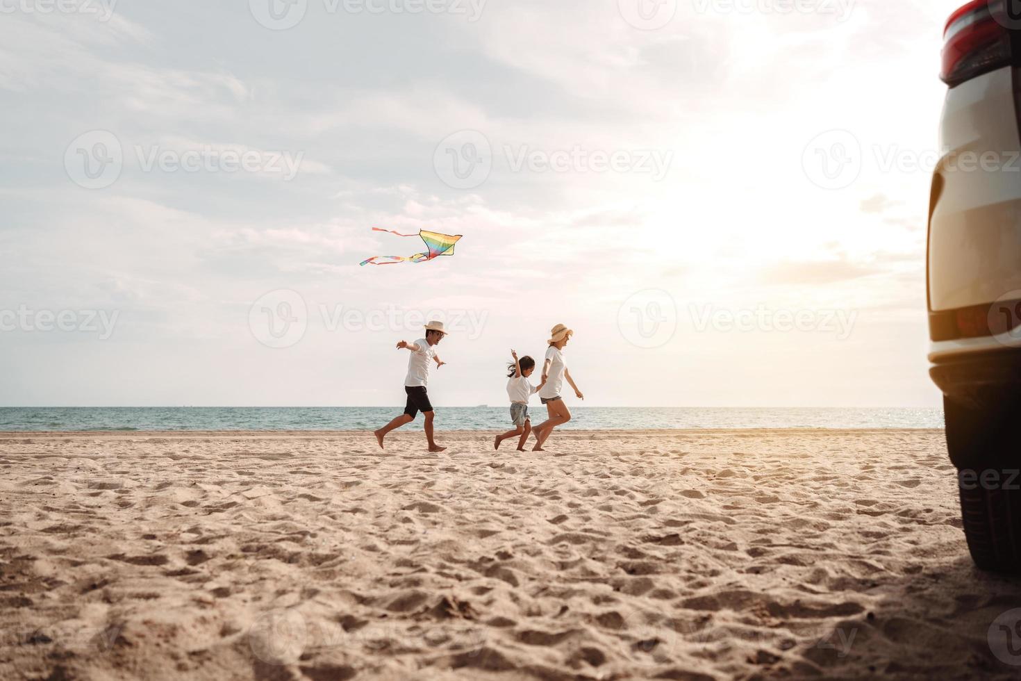 Happy Family with car travel road trip. summer vacation in car in the sunset, Dad, mom and daughter happy traveling enjoy together driving in holidays, people lifestyle ride by automobile. photo