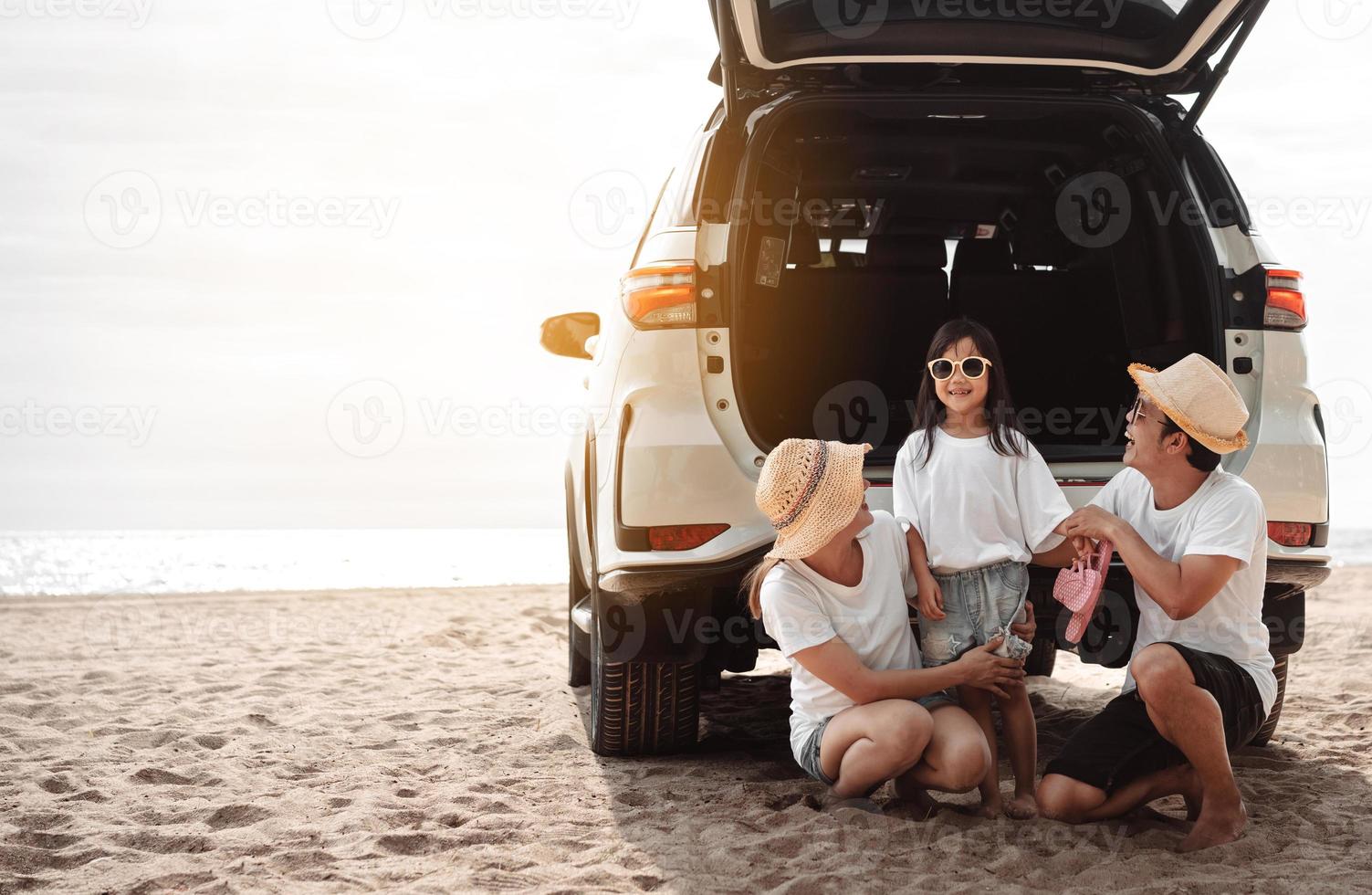 Family travel car road trip concept. summer vacation in car in the sunset, Dad, mom and daughter happy traveling enjoy and relaxation together driving in holidays, people,lifestyle with transportation photo