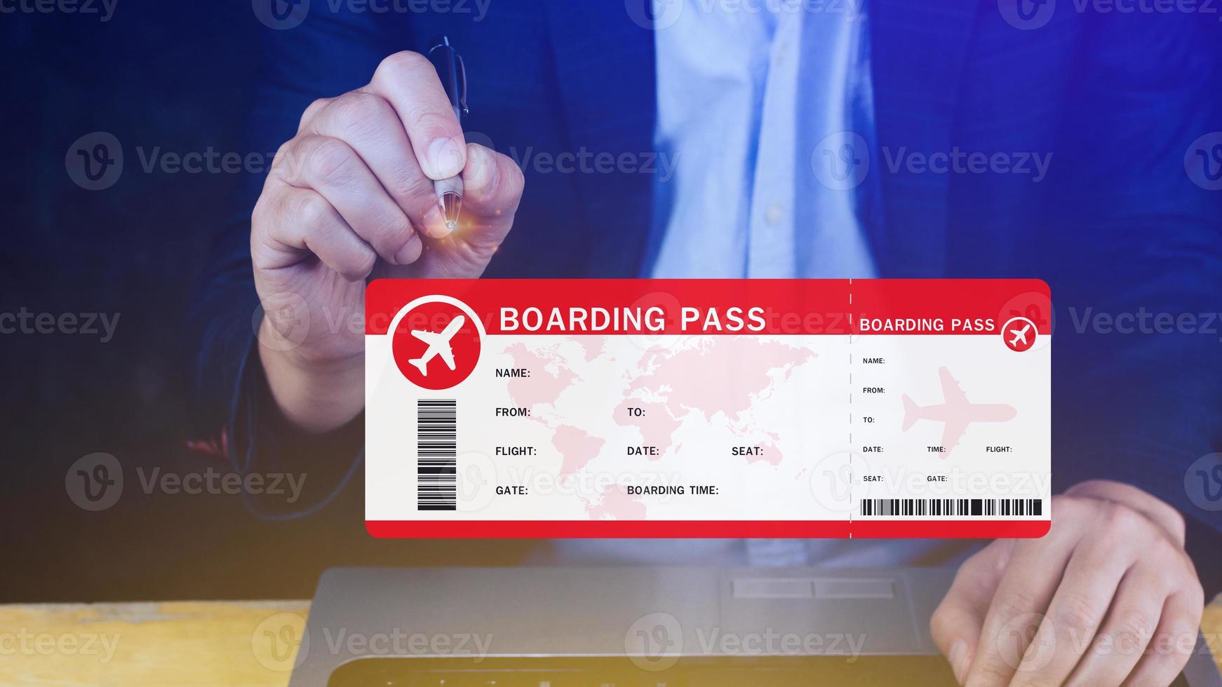 Hand holding boarding pass tickets air travel concept, Choosing checking electronic flight ticket on laptop. photo