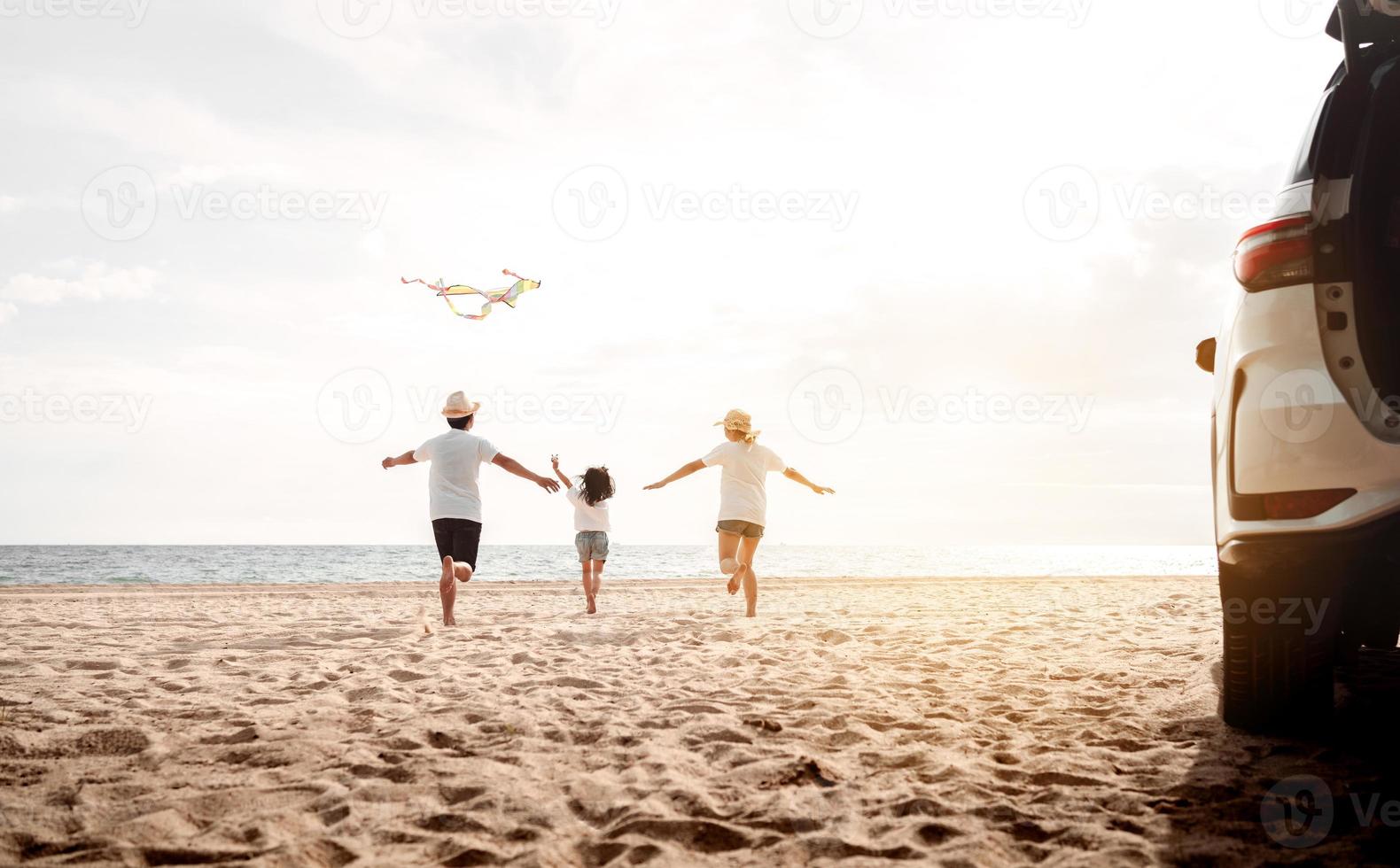 Happy Family with car travel road trip. summer vacation in car in the sunset, Dad, mom and daughter happy traveling enjoy together driving in holidays, people lifestyle ride by automobile. photo