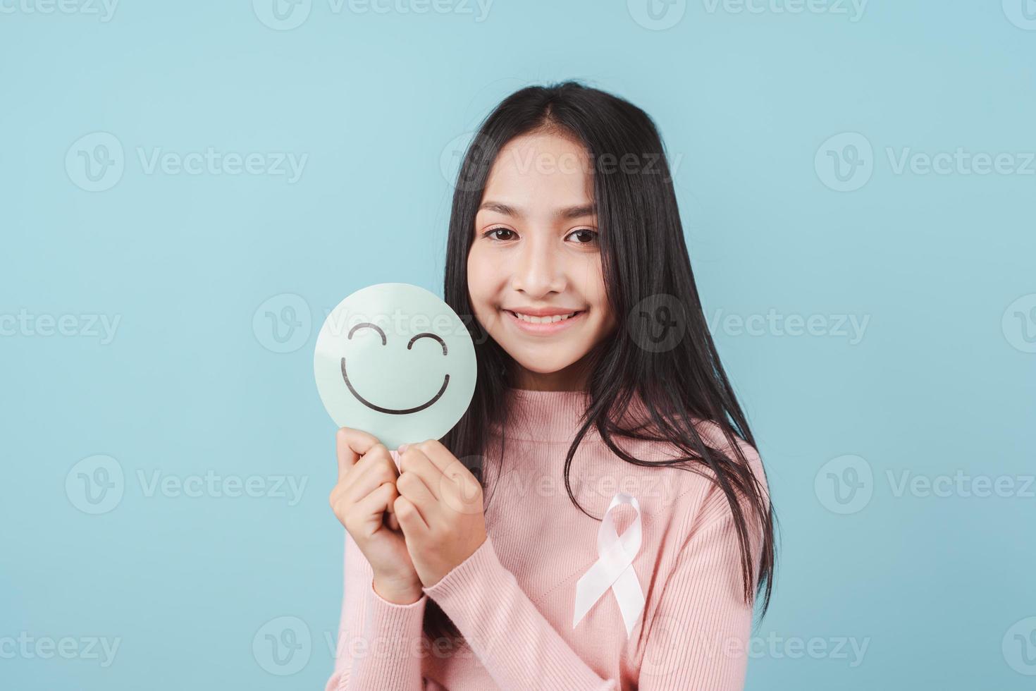 woman holding happy smile face on paper cut, user giving good feedback rating, think positive , customer review, assessment, of mental health day, Compliment Day, satisfaction concept. photo