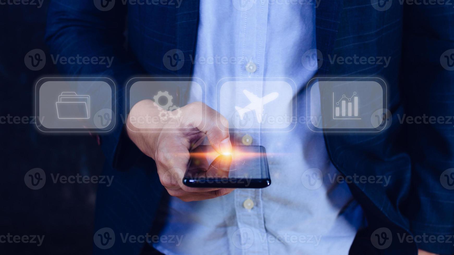 Businessman touching smartphone to select flight by pressing touch screen airplane button,Business Airplane transportation concept photo