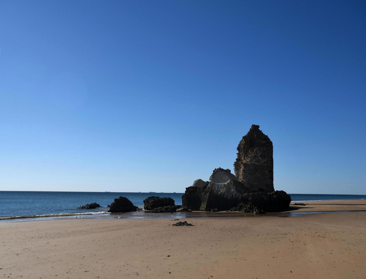 Remains of a watchtower on Gold River beach photo