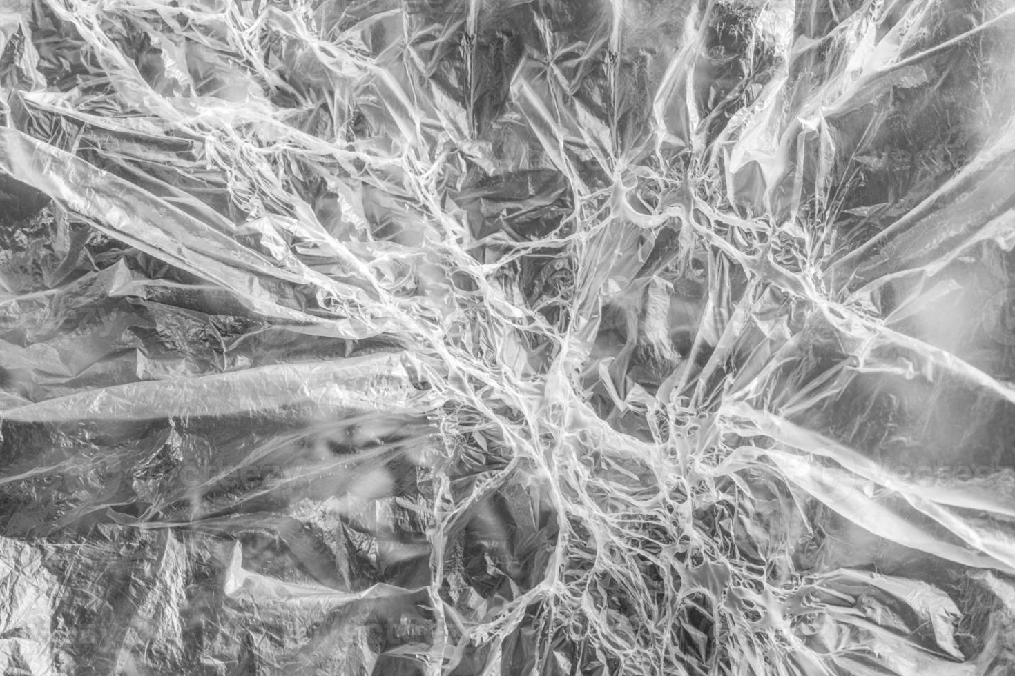 Smoothed and melted parts of celluloid film alternates creating a fantasy pattern. Soft focus. photo