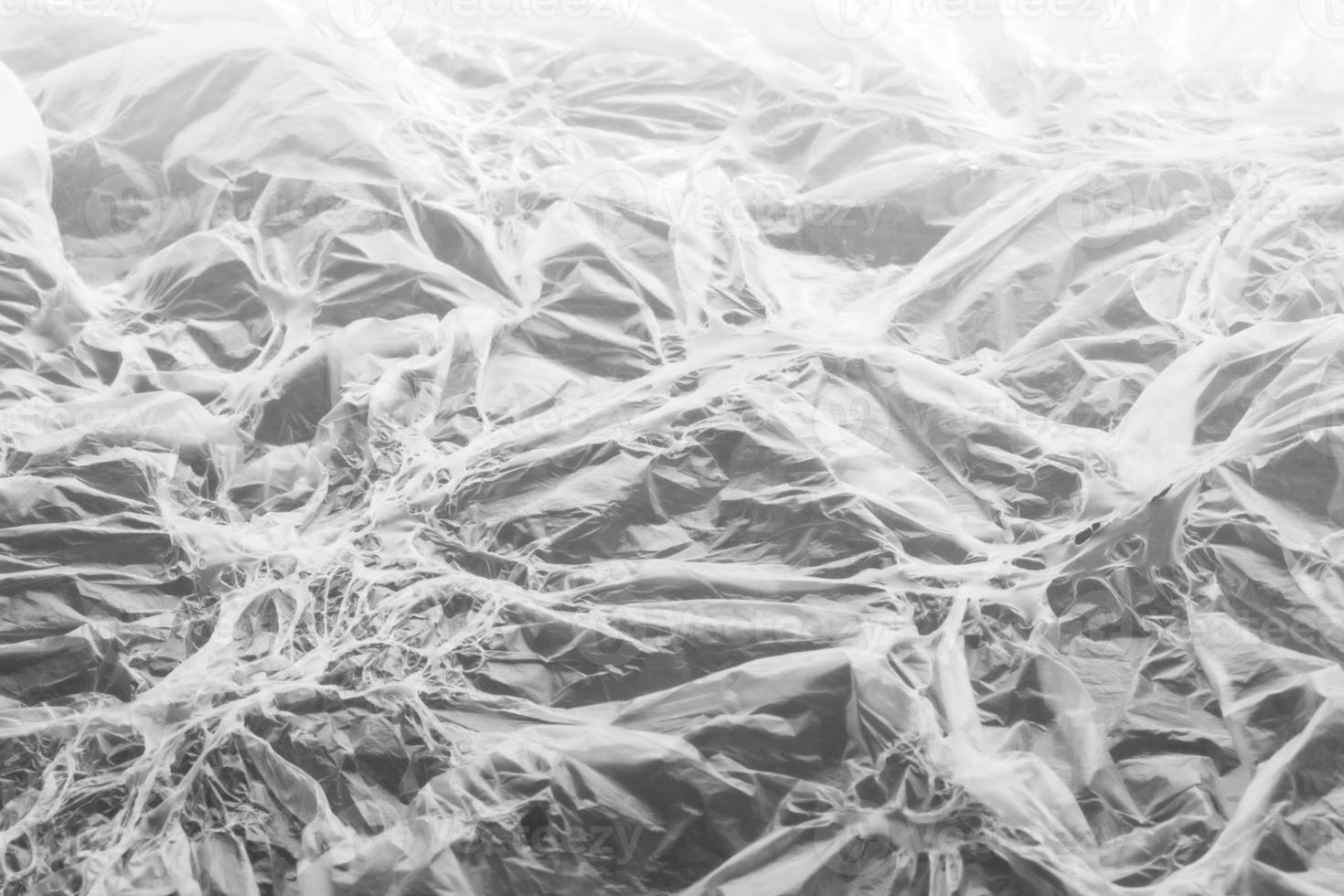 Interesting texture of white melted polyethylene on gray background. Fantasy pattern with different illumination. Unusual background or wallpapers. Selective focus. Horizontal orientation. photo