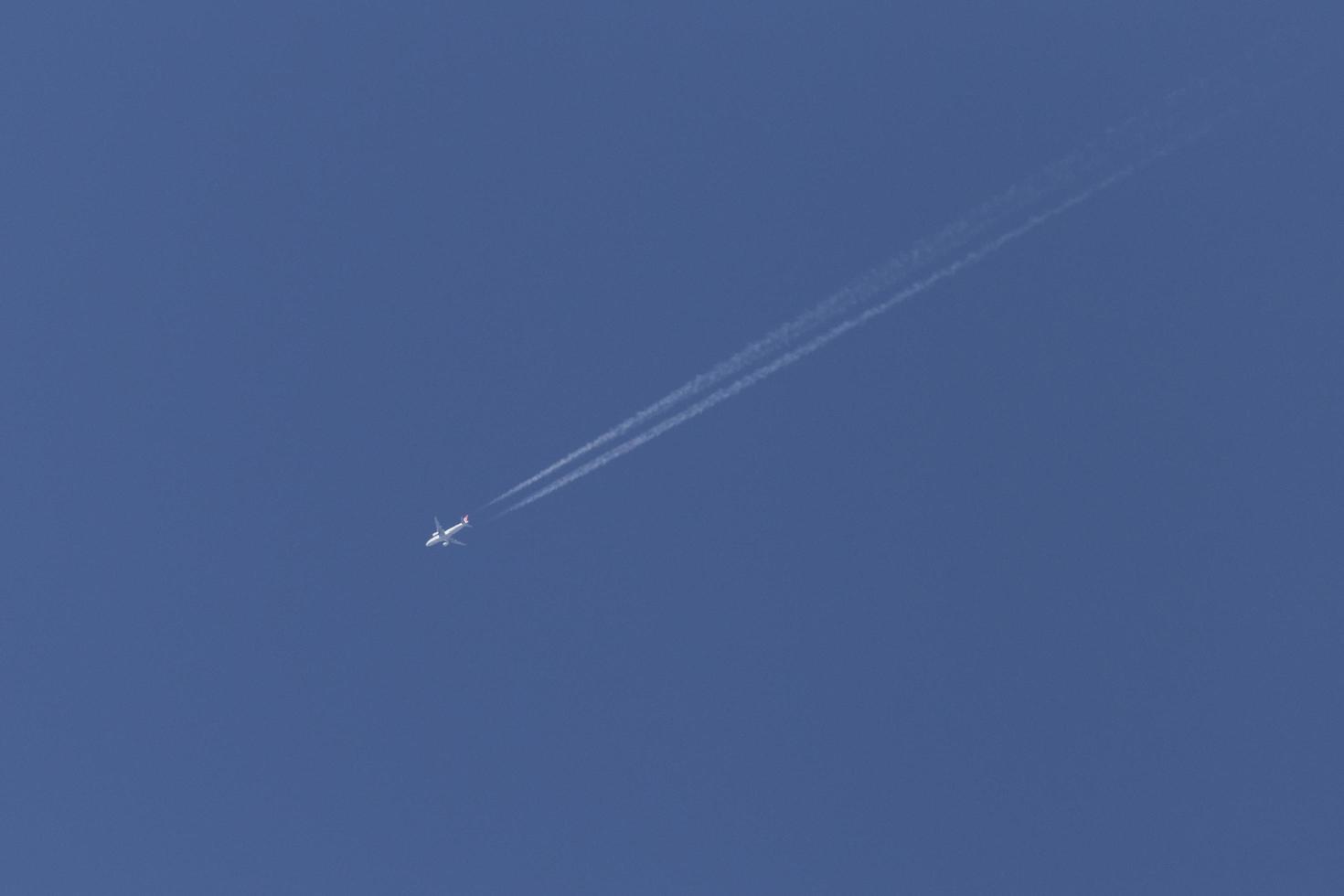 aircraft flying in a clear blue sky photo