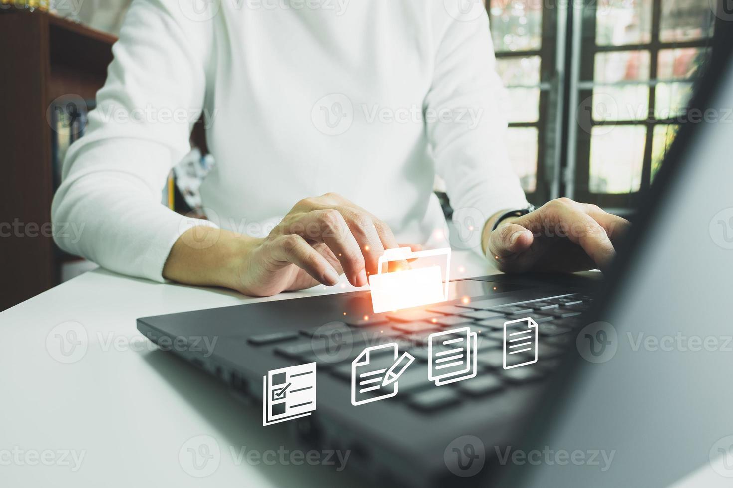 Officer using laptop manage files, Document Management System , Online document database management, automated processes to manage system, ERP enterprise efficient, business technology. photo